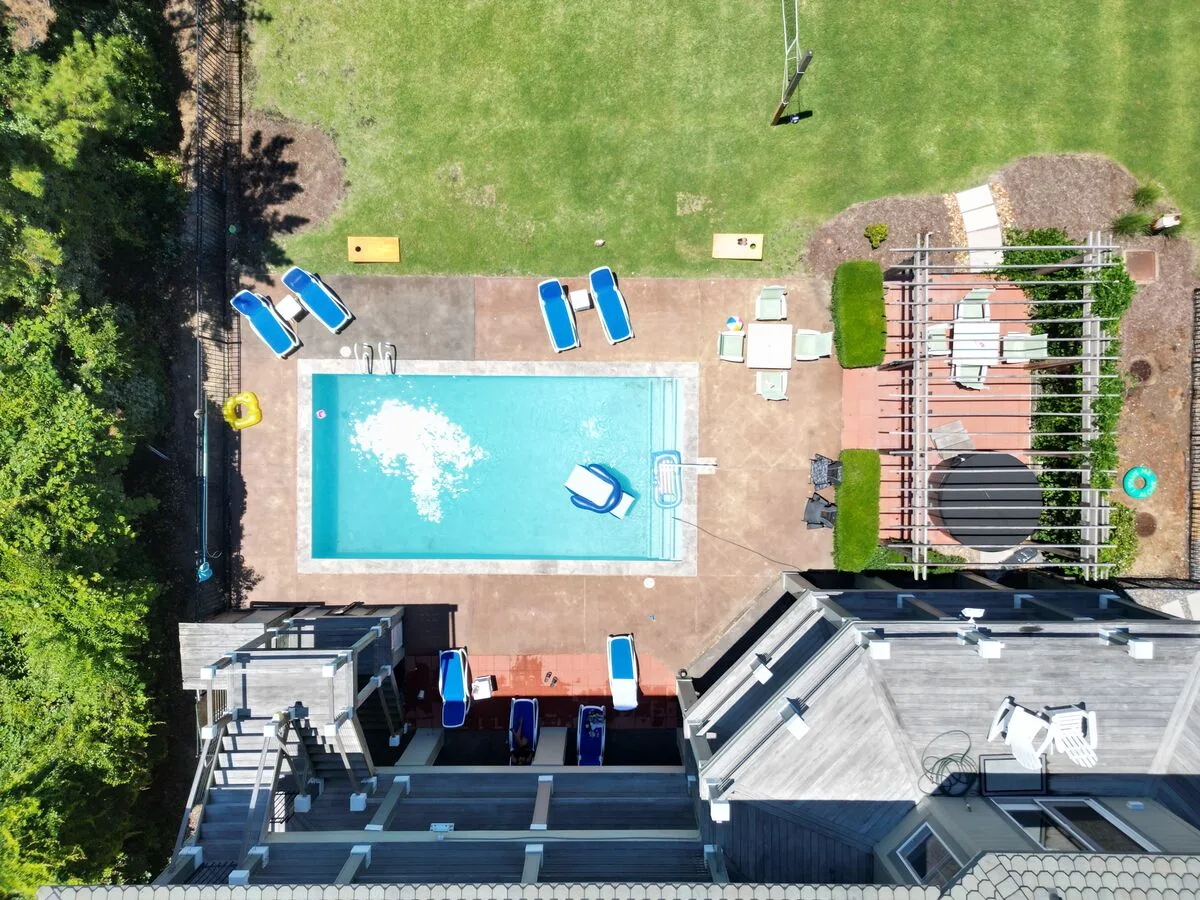 Aerial view of a property with a pool